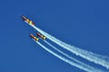 Four aerobatic airplanes flying during an air show