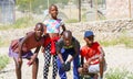 Four African youth two girls and two boys enjoy posing for photo