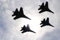 Four aircraft combat fighters a great strong powerful SU-34 military fighters flying in the sky