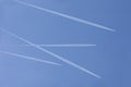 Four aircrafts in the ski make a graphic sign with condensation trails with copy space for your text