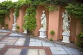 Four alabaster statues of women