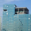 Four alpinist climbing for cleaning the building window glass