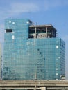 Four alpinist climbing for cleaning the building window glass