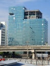 Four alpinist climbing for cleaning the building window glass