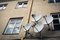 Four antennas on the beige wall Royalty Free Stock Photo