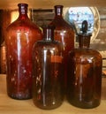 Four antique brown bottles Royalty Free Stock Photo