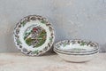 Four antique porcelain bowls on concrete Royalty Free Stock Photo