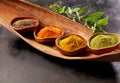 Four assorted spices in rustic bowls Royalty Free Stock Photo