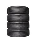 Four automobile black rubber tires on white