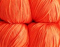 Four balls of yarn for knitting in peach color Royalty Free Stock Photo