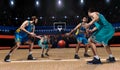 Four basketball players in game action