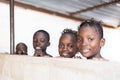 Four Beautiful African Black Children Smiling Cheerfully at Camera Royalty Free Stock Photo