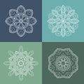 Four beautiful circular ornament on a colored background. Mandala. Stylized flowers. Vintage decorative elements. Royalty Free Stock Photo