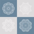 Four beautiful circular ornament on a colored background. Mandala. Stylized flowers. Vintage decorative elements. Royalty Free Stock Photo