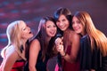 Four beautiful girls singing karaoke Royalty Free Stock Photo