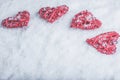 Four beautiful romantic vintage hearts on a white frosty snow background. Love and St. Valentines Day concept.