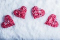 Four beautiful romantic vintage hearts on a white frosty snow background. Love and St. Valentines Day concept. Royalty Free Stock Photo