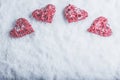 Four beautiful romantic vintage hearts on a white frosty snow background. Love and St. Valentines Day concept. Royalty Free Stock Photo
