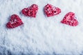 Four beautiful romantic vintage hearts on a white frosty snow background. Love and St. Valentines Day concept.