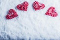 Four beautiful romantic vintage hearts on a white frosty snow background. Love and St. Valentines Day concept. Royalty Free Stock Photo