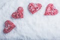 Four beautiful romantic vintage hearts on a white frosty snow background. Love and St. Valentines Day concept. Royalty Free Stock Photo