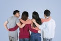 Four best friends embrace each other on studio