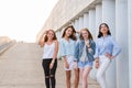 Four best girlfriends looking at camera together. people, lifestyle, friendship, vocation concept Royalty Free Stock Photo