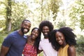 Four black adult friends in the forest, head and shoulders