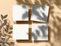 Four Blank Square Cards Mockup with Natural Leaf Shadows on Beige Background Royalty Free Stock Photo