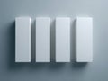Four blank vertical rectangular boxes arranged in a row casting soft shadows on a neutral gray surface for minimalistic product Royalty Free Stock Photo