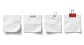 Four blank white paper notes with attached clips and fasteners isolated on white Royalty Free Stock Photo