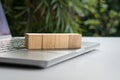 Four blank wood toy blocks on top of computer laptop Royalty Free Stock Photo