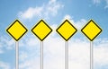 Four blank yellow traffic sign Royalty Free Stock Photo