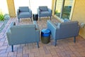 Four Blue Arm Chairs In Conversation Area Of Paver Patio