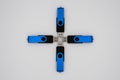 Four blue black USB sticks in a formation on a white background Royalty Free Stock Photo