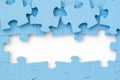 Four blue puzzle pieces revealing white background Royalty Free Stock Photo