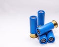 Four blue, rifled 12 gauge shotgun shells