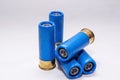 Four blue, rifled 12 gauge shotgun shells