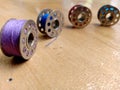 Four bobbins are placed in rolling position Royalty Free Stock Photo