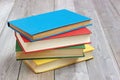 Four books in the colored cover on the table Royalty Free Stock Photo