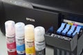 Four bottles of ink Epson, yellow, red, blue, black, built-in to the Epson L3150 series printer.