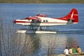 Four Boys Watching Taxying Seaplane, Yellowknife. Royalty Free Stock Photo