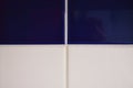 Four bright blue and white tiles, frame divided into four parts