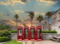 Four British Phone Booths At Sunset