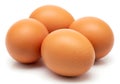 Four brown eggs arranged on a white background Royalty Free Stock Photo