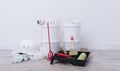 Four buckets, bath and paint rollers, red mixer, repair kit Royalty Free Stock Photo