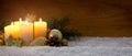 Four burning advent candles and Christmas decoration. Royalty Free Stock Photo