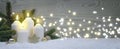 Four burning Advent candles with golden decoration and white snow. Royalty Free Stock Photo