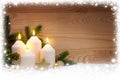 Four burning Advent candles and snow frame. Royalty Free Stock Photo