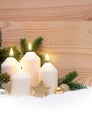 Four burning Advent candles and white snow. Royalty Free Stock Photo